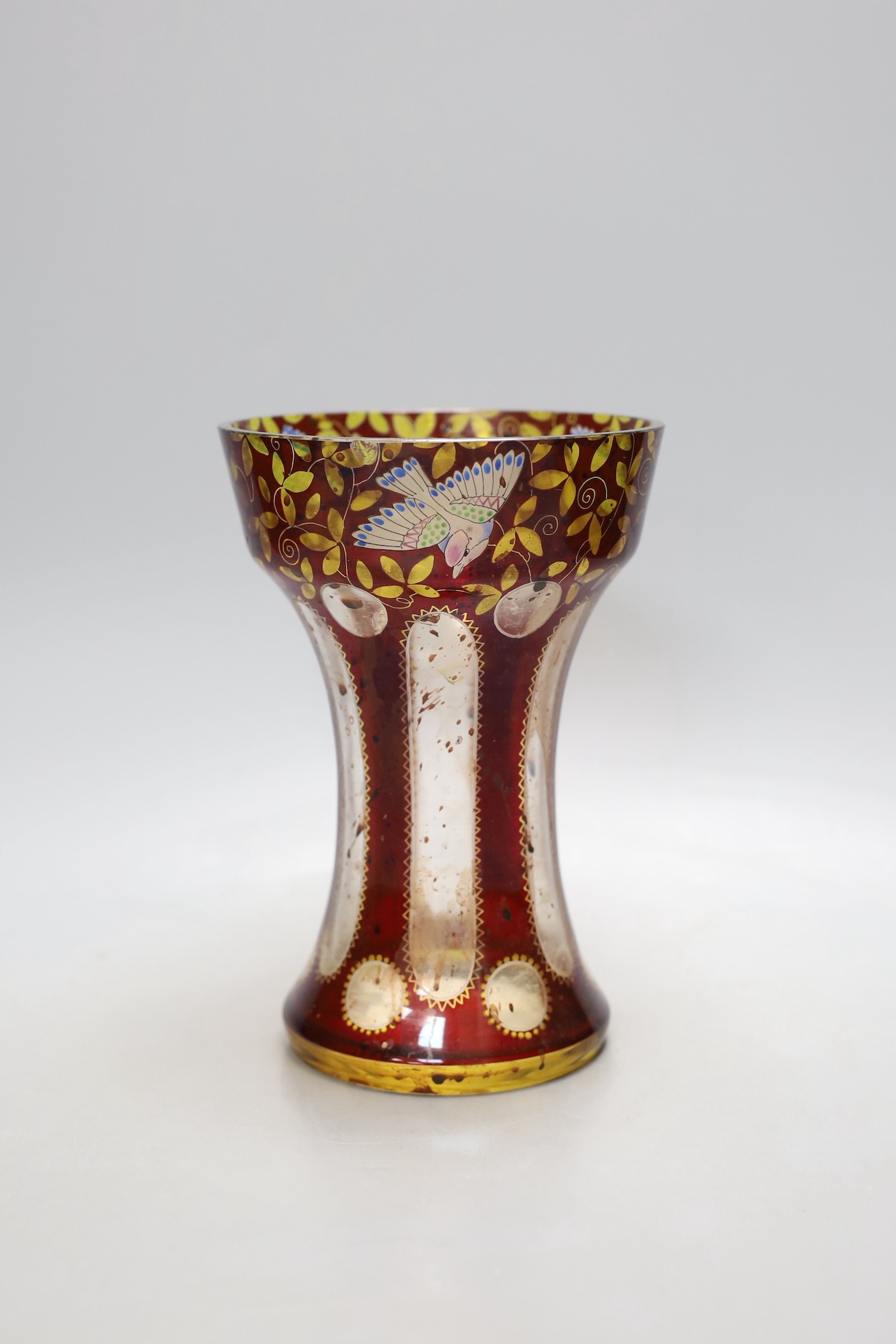 An American? enamelled glass vase and a ruby glass bowl, bowl 23.5 cms diameter.